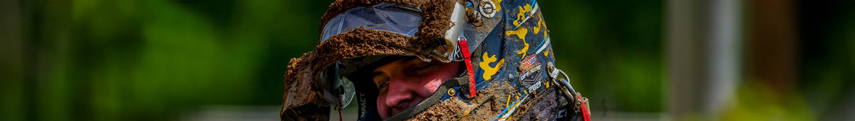 Helmet shields and tear-off kits—clear and dark shields, adhesive tear-offs, and replacement tear-off strips